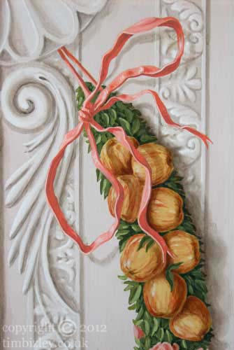 painted red ribbon tied in a bow to fruit festoon