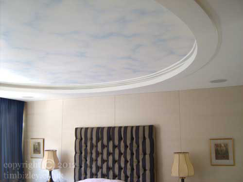 contemporary setting for painted blue sky and clouds ceiling