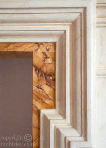 yellow sienna and white carrara faux marble paint effect on fire surround