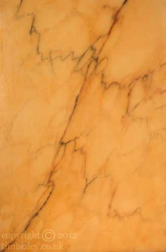 painted yellow sienna simulated faux marble