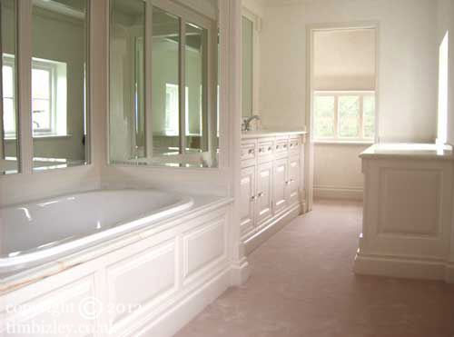 pale paint effects enhance fitted bathroom furniture