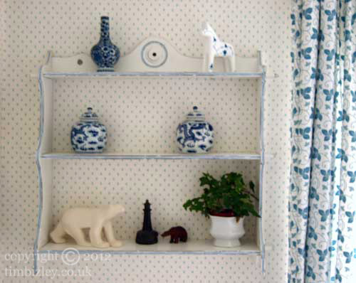 shabby chic paint effect makes shelves look antique and mellow