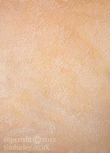 yellow ochre paint effect on a textured surface