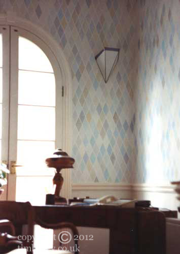 geometric art deco style stencilled wall in blue