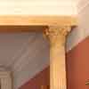 faux stone effect in warm browns and yellows painted on columns