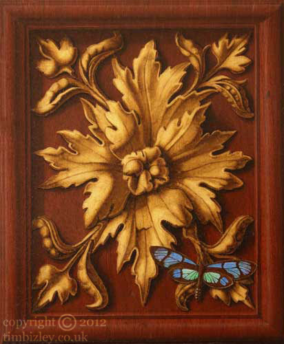 trompe loeil depicting butterfly on carved and gilded panel