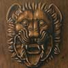 painting gives illusion of a lion head carved in oak