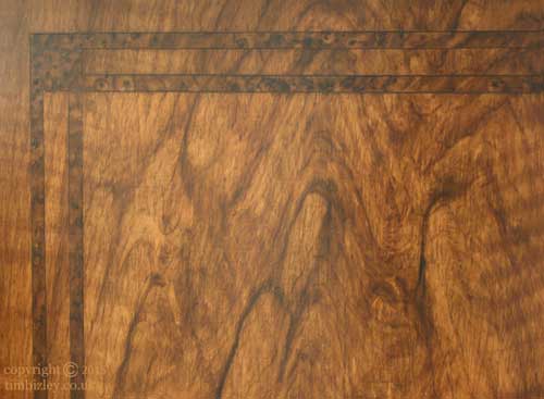 wood graining of cabinet doors to look like marquetry inlay in burr wood